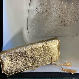 Jewelry case gold lame 3 zipper pockets 2 ring bars 1 open pocket at top & ties